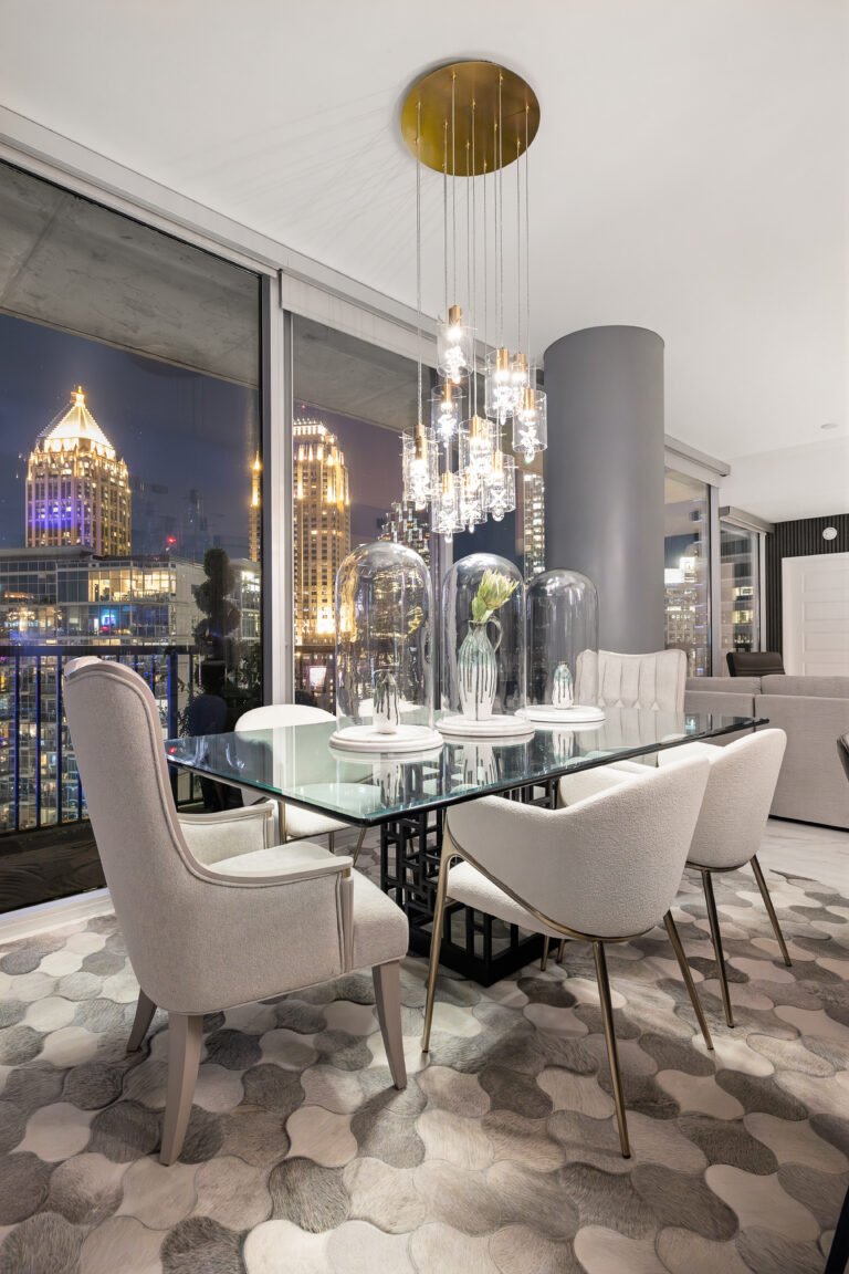 Dining room with crystal pendants and the city at night