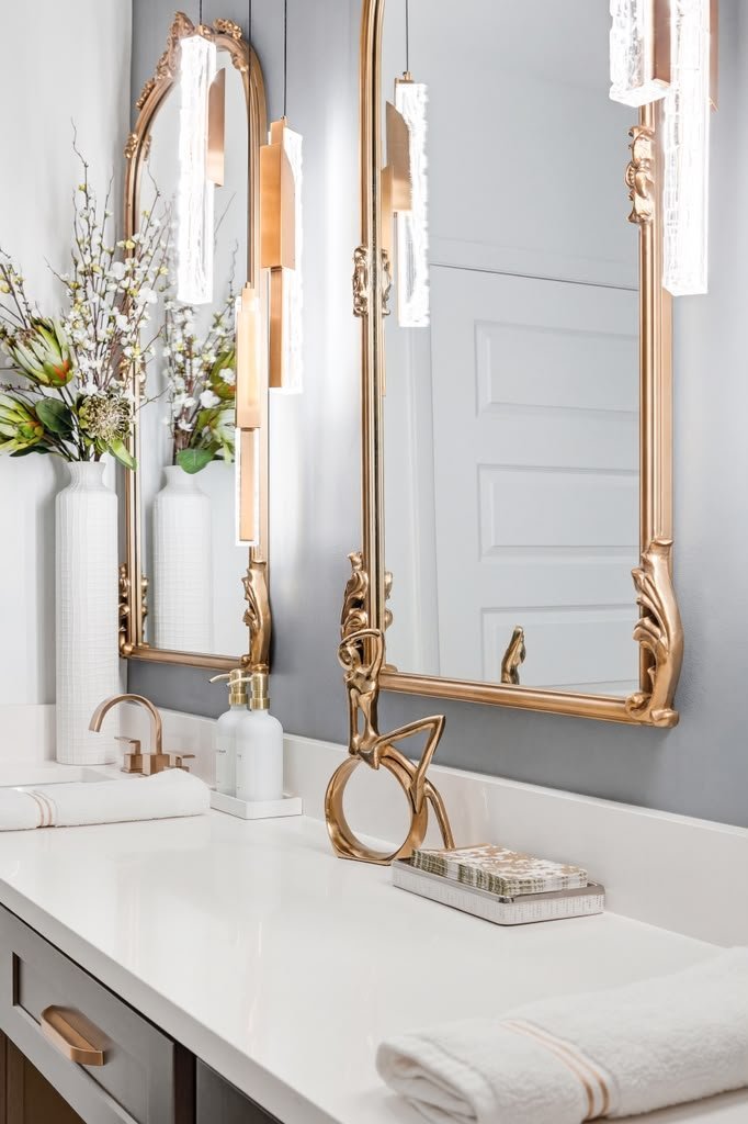 Gilt mirror and brushed brass fittings over the vanity