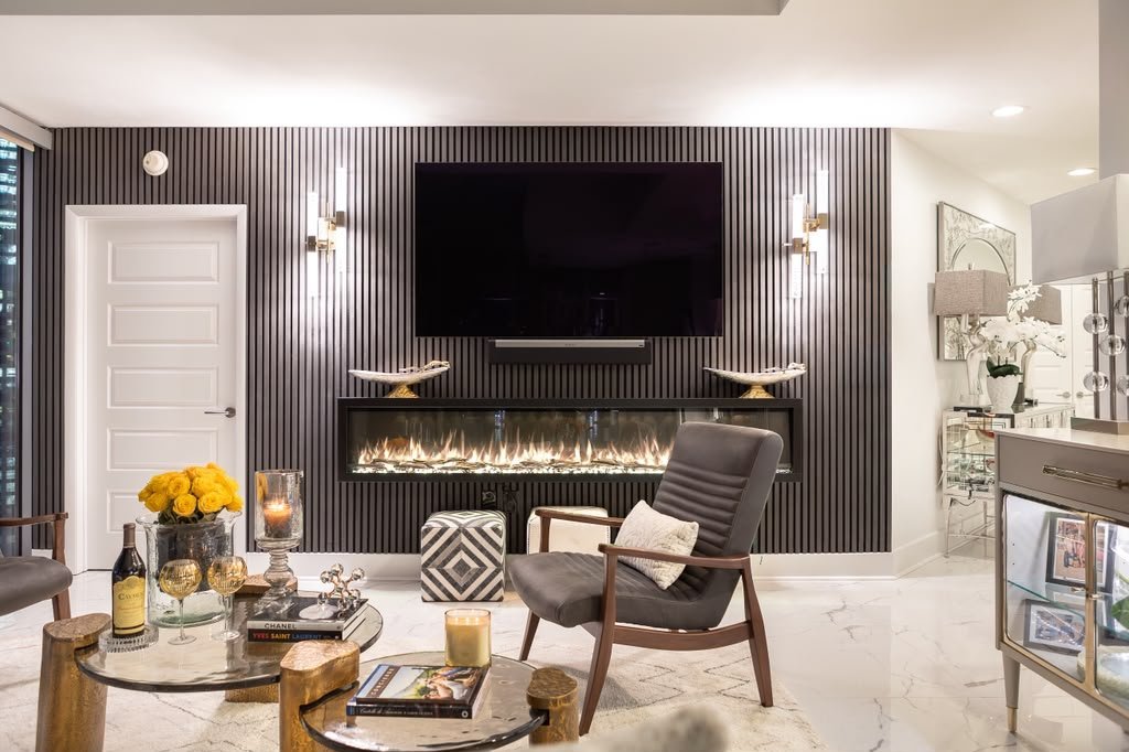Living room with a fluted walnut feature wall and linear fireplace