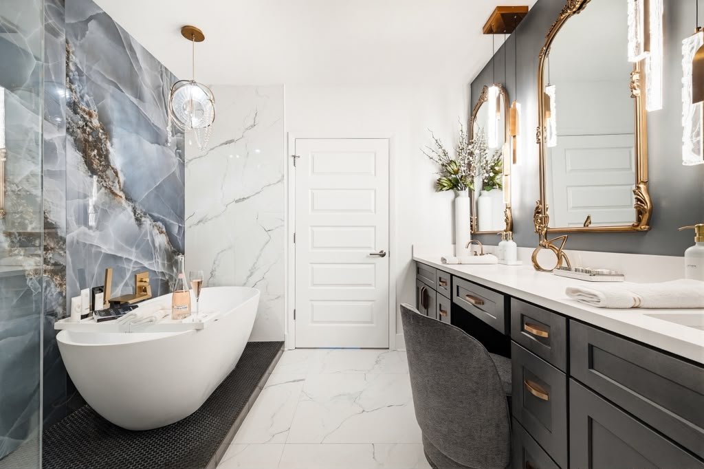 Primary bathroom seen from the onyx wall to the vanity