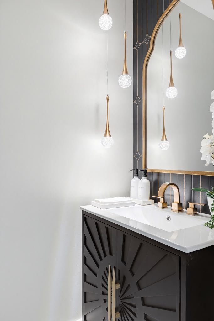 Powder room with an Art Deco sunburst vanity