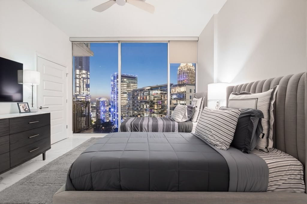 Bedroom with charcoal linen and night windows
