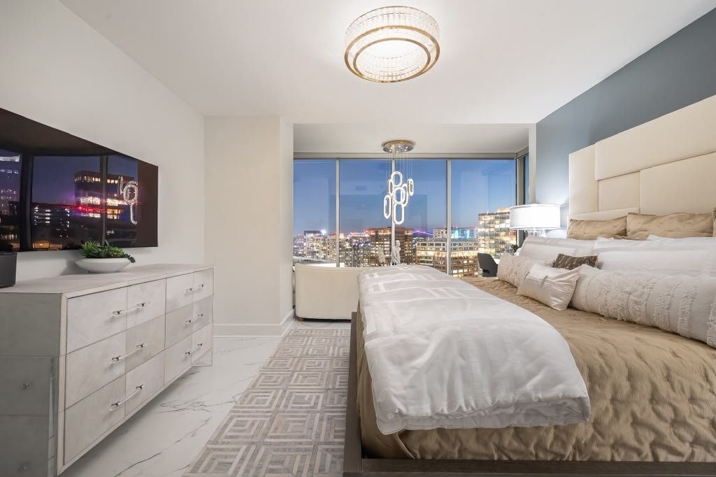 Bedroom in cream with a Greek key rug