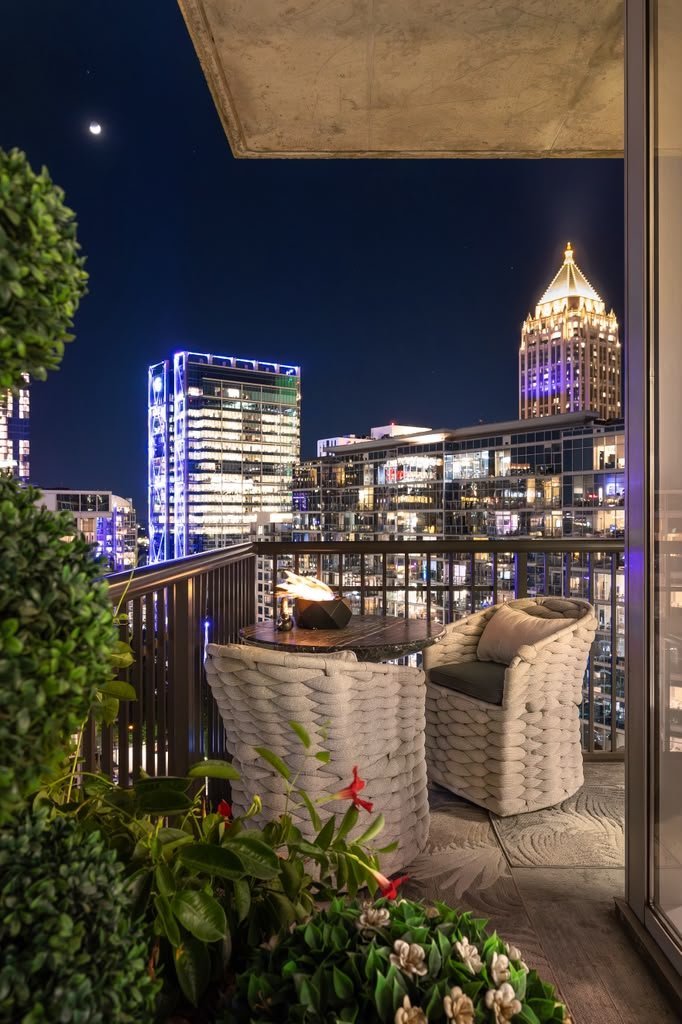Terrace at night with the moon over the tower crowns