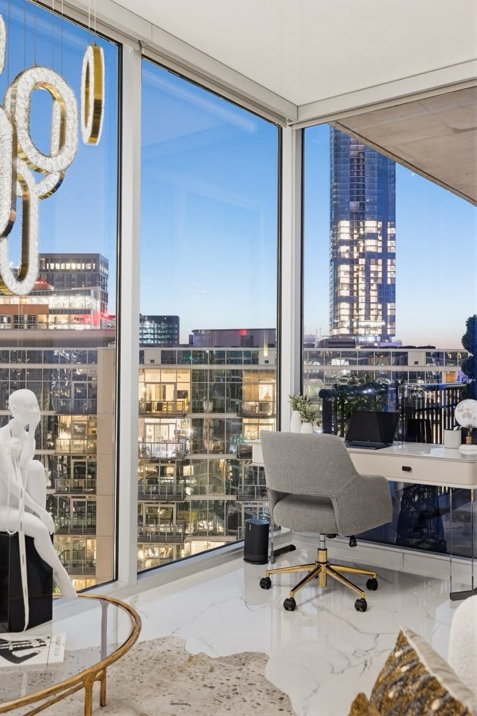 Study with a desk set against the city skyline